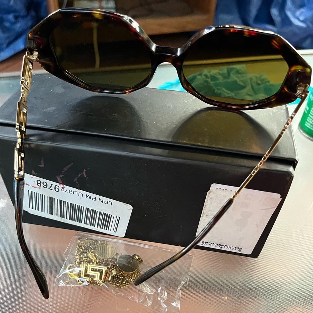 Beautiful Versace glasses with matching glass chain.